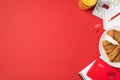 Top view photo of workplace keyboard clips red pencil organizers glass of juice and plate with two fresh croissants on isolated