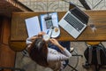 Top view photo of freelancer drinking hot cup of Cappuccino