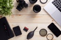 Top view of photographer desk with latptop, camera, lenses and accessories with copy space Royalty Free Stock Photo