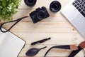 Top view of photographer desk with latptop, camera, lenses and accessories with copy space Royalty Free Stock Photo