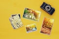 Top view of photographs next to old camera Royalty Free Stock Photo