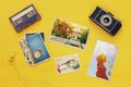 Top view of photographs next to old camera Royalty Free Stock Photo