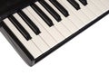 Top view of piano keyboard with white and black keys on white background Royalty Free Stock Photo