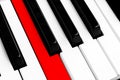 Top view of piano keys with one red button. Close-up of piano keys. Close frontal view. Piano keyboard with selective focus. Diago Royalty Free Stock Photo