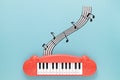 top view piano toy with blue background. High quality photo