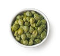 Top view of pickled capers in ceramic bowl Royalty Free Stock Photo