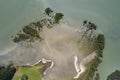 Top view of a piece of beach that runs into the water in Northland, New Zealand