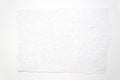 A piece of handmade rough-edged paper on a white paper background Royalty Free Stock Photo
