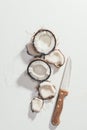 top view of pieces of natural healthy coconut and knife