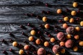 top view of pile of cherries apricots and peaches on wooden