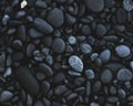 Top view of a pile of dark stones - a good choice for natural patterned backgrounds