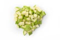 Top view on a pile of diced green zucchini on white background Royalty Free Stock Photo