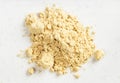 Top view of pile of ginger powder close up on gray