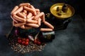 top view of pile of raw long wieners on antiquarian scales Royalty Free Stock Photo