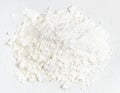 Top view of pile of wheat flour close up on gray