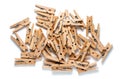 Top View of Pile of Wooden Clothespins Isolated on White Background