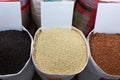 Top view,Piles of Black,Yellow and Red Rice,unpolished grain,Thai aromatic rice in the sacks at market,grocery store,Khao Hom Mali