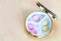Top view of pillbox with pink and yellow pills Royalty Free Stock Photo