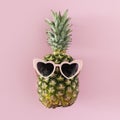 top view pineapple with heart shaped sunglasses