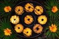 top view of pineapple rings on a barbecue grate