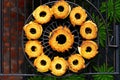 top view of pineapple rings on a barbecue grate