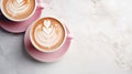 A top view of pink cappuccino mugs on a sleek marble table, promising a delightful coffee break Royalty Free Stock Photo