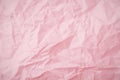 Top view of pink crumpled paper background