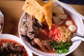 Top view of Pink seafood flat noodles in bowl