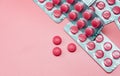 Top view of pink tablets pill and blister pack of pills on pink background. Prescription drugs. Pharmaceutical industry. Pharmacy Royalty Free Stock Photo