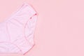 Top view Pink underpants isolated on pink background with copy space. Woman hygiene, Concept of critical days, menstruation,health