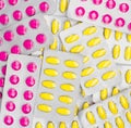 Top view of pink and yellow tablets pill in blister packs. NSAIDs can irritated stomach cause gastric ulcer. Royalty Free Stock Photo