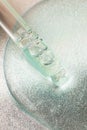 Top view of pipette in cosmetics gel.Vertical photography