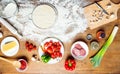 Top view of pizza ingredients, tomatoes, salami and mushrooms