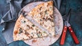 Top view pizza with mushrooms and cheese on a round board. Fork, knife and napkin. Pizza time concept Royalty Free Stock Photo