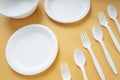 Top view - Plastick plate and spoon and fork. Disposable untensil Royalty Free Stock Photo