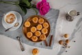 Top view of a plate of biscuits with a cup of coffee and a flower Royalty Free Stock Photo