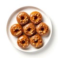 Top view of plate with caramel peanut donuts.