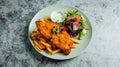 Top view of plate with chicken meat, french fries and salad Royalty Free Stock Photo