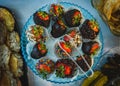 Top view of a plate of chocolate-covered strawberries for a banquet Royalty Free Stock Photo