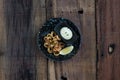 Top view of a plate of crunchy deep fried squid rings, calamari with smoky red bell pepper, almond, cherry vinegar, tomato and ca Royalty Free Stock Photo