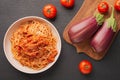 Top view plate EGGPLANT PASTA like a Calabrese and vegetables for cooking on dark background