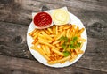 Top view on plate with french fries, tomato sauce and mayonnaise Royalty Free Stock Photo