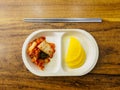Top view of plate with kimchi and radish traditional Korean fermented food. Seoul, South Korea Royalty Free Stock Photo