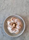 Top view of a plate of puffertjes on a keramic table. Copy space Royalty Free Stock Photo