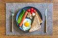 Top view of a plate with scrambled egg, toast, shrimp and vegetables Royalty Free Stock Photo