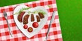 Top view plate in shape of heart with fried meat