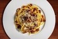 Top view of plate with spaghetti carbonara and grated cheese Royalty Free Stock Photo