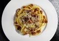 Top view of plate with spaghetti carbonara and grated cheese Royalty Free Stock Photo