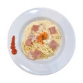 Top view of plate with spaghetti in carbonara sauce and chicken ham on white background. cut out isolated Royalty Free Stock Photo