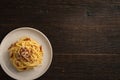 Top view plate spaghetti carbonara on wooden table with copy space Royalty Free Stock Photo
